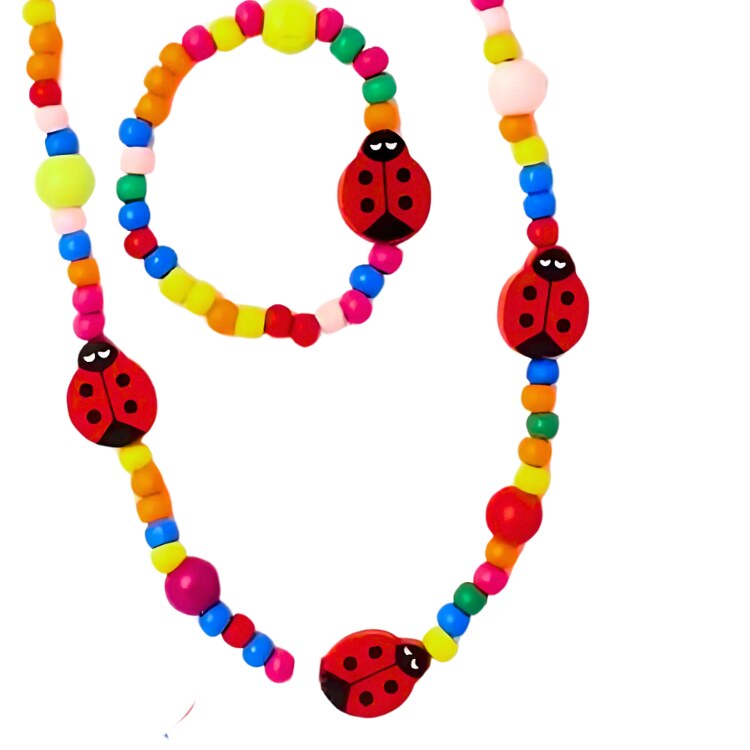 The molly & rose Ladybird Wooden Bead Necklace and Bracelet Set is a vibrant addition to party bags, featuring playful multicolored beads in yellow, blue, red, green, and pink with charming red ladybug accents.