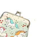 The molly & rose Unicorn Print Coin Purse is a charming rectangular accessory featuring a clasp and adorned with a playful unicorn design showcasing pastel-colored manes. Set against a light background sprinkled with tiny stars and hearts, it makes for an enchanting stocking-filler for any unicorn enthusiast.