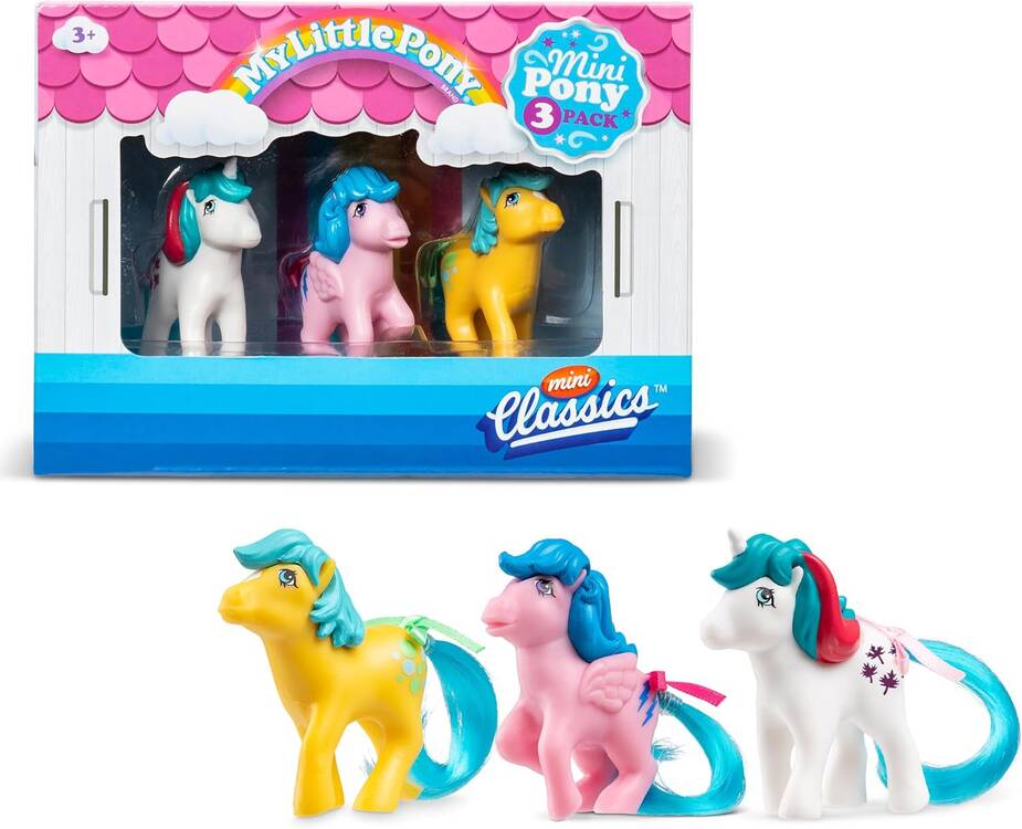 The Basic Fun My Little Pony Mini Classics 3-pack includes a white pony with pink hair, a yellow pony with blue hair, and a pink pony with blue and teal hair. The packaging features whimsical pink and white clouds, ideal for ages 3+.