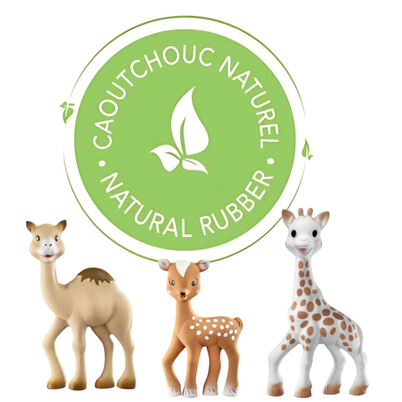 A camel, a fawn and Sophie la girafe® (il était une fois) by Sophie La Giraffe stand before a green emblem reading “CAOUTCHOUC NATUREL, NATURAL RUBBER,” emphasizing the natural teething toy’s appeal.