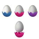 Three boiled eggs stand upright in vibrant Schylling NeeDoh Magic Colour Egg holders—blue, pink, and purple. A fourth egg sits below in a red holder. Each squishy holder features a jagged top resembling a cracked eggshell, bringing an element of fidget fun to your kitchen decor.