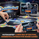 A vivid display of the "Outsmarted!" board game by Q Play features a dynamic digital component on both phone and tablet screens. The tablets showcase an astronaut graphic, representing the groundbreaking era of remote-play in engaging, immersive, and interactive board games. Text reads, "OUTSMARTED® A new era of gaming!
