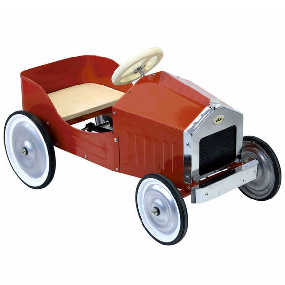 The Vilac - Large Pedal Car in red features a shiny chrome grille and white steering wheel. Its four large black rubber tires and silver rims offer a timeless design, perfect for apprentice drivers seeking an open seat adventure against a plain white background.