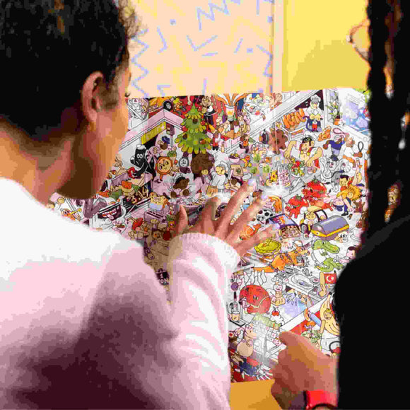Two people are examining the Riddle Pics - Mayhem in the Library poster from Big Potato, which is filled with a vibrant array of cartoon characters and objects. The scene is bustling with activity, akin to an intricate search through visual riddles, suggesting an engaging exploration experience.