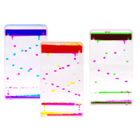 Three Sensory Motion Bubbler Stairs by Sensory Motion feature colorful droplets for stress relief. The left one has purple and blue, the middle displays red and yellow, and the right shows green and purple droplets cascading diagonally like a soothing fidget toy.