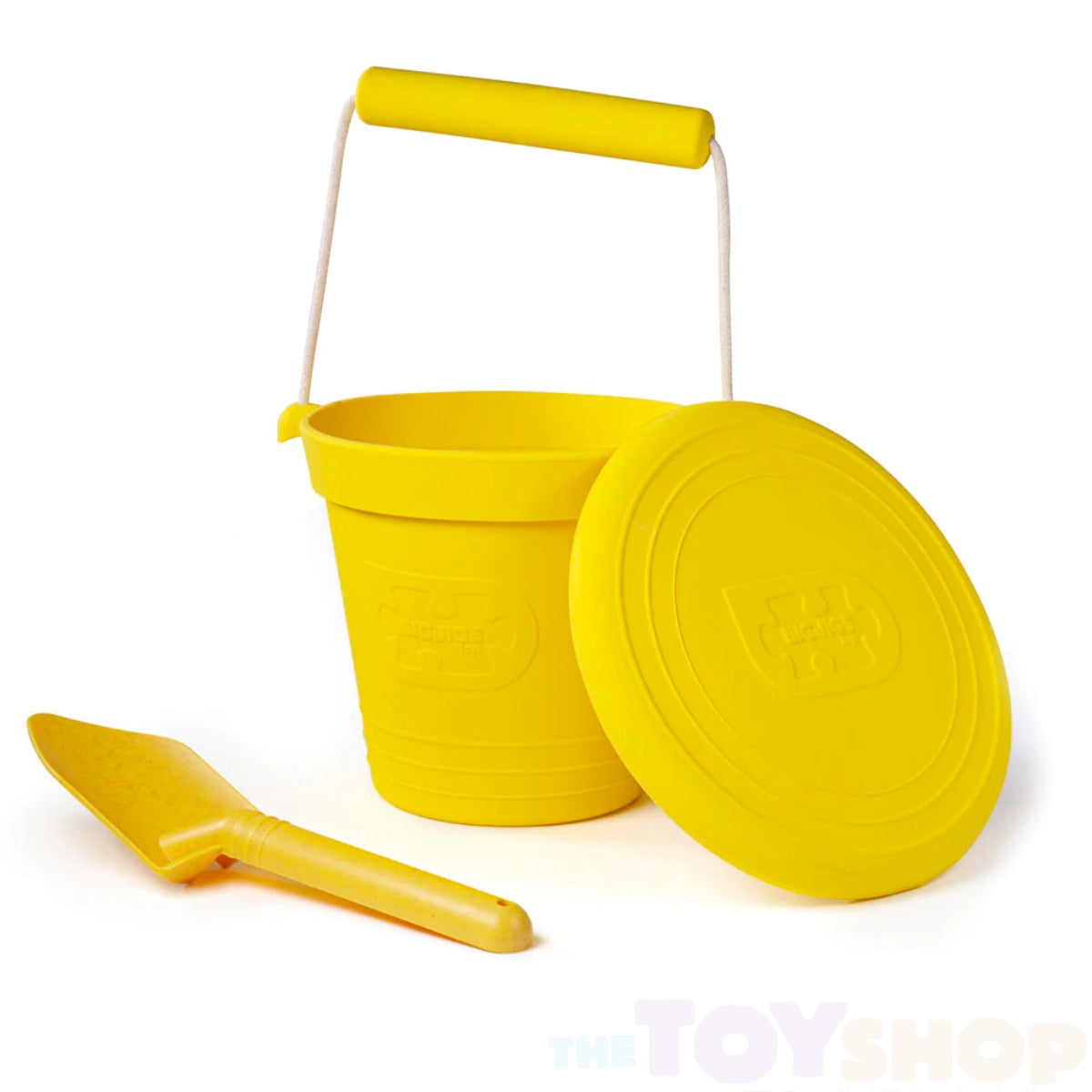 Yellow silicone kids bucket with matching frisbee and small spade.