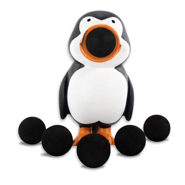 The Squeeze Popper: Penguin toy by Cheatwell Games showcases a playful design with a penguin shape. It features a black foam ball in its beak with an additional six balls around it. With its white belly and orange feet, this entertaining toy is perfect for both indoor and outdoor fun against a clean white backdrop.