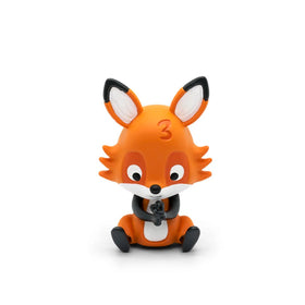 An adorable orange fox figurine with big ears and the number "3" on its head, sitting with its legs crossed and eyes gazing downwards, perfectly encapsulates the playful charm of multilingual counting fun. This whimsical character brings to mind the enchanting Tonies' product, Tonie - Favourite Children's Songs - Counting Songs series.