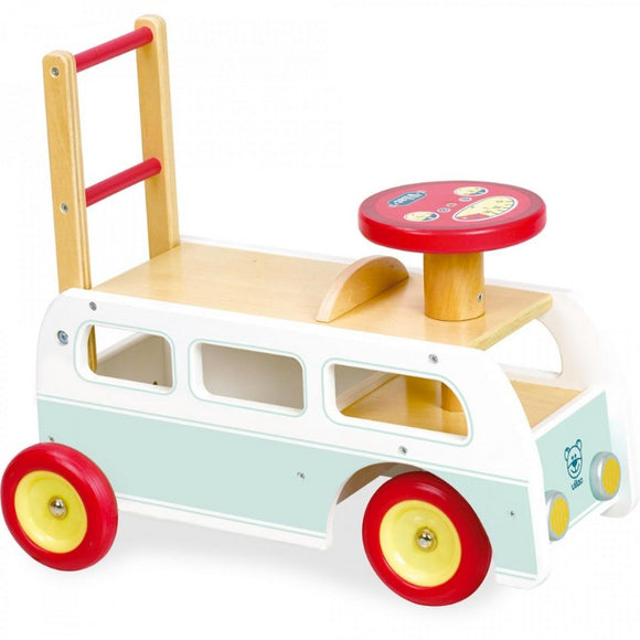 The Vilac 2-in-1 Retro Wooden Camper Van is a charming ride-on toy from Vilac. Shaped like a retro campervan, it features red and yellow wheels, a red steering wheel, and a rear ladder. Painted light blue and white with a playful bear face on the front, it's perfect for fun adventures.