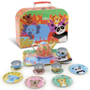 The Vilac Jungle Tea Set is a vibrant collection featuring pandas, elephants, and tigers. This high-quality tin set includes a suitcase, teapot, tray, cups, saucers, and plates—all with matching playful designs.