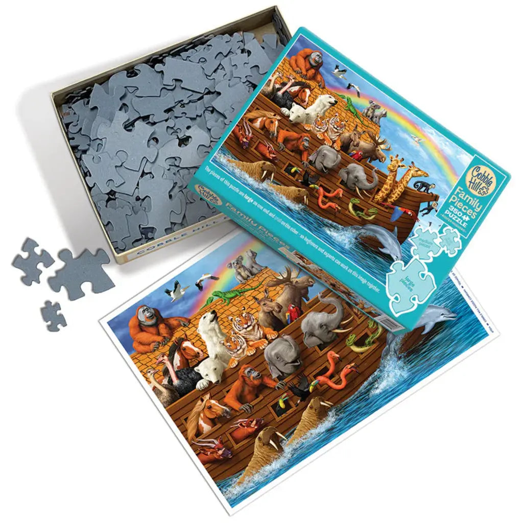 The Voyage of the Ark (350 pieces) Family jigsaw by Cobble Hill depicts animals like elephants, giraffes, and lions aboard a wooden boat, reminiscent of Noah's Ark. They gather under a rainbow in the blue sky, creating a delightful scene.