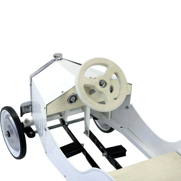 The Vilac - Large Pedal Car - White offers a timeless, vintage look with a white body and beige steering wheel. Ideal for young drivers, it features black pedals, silver detailing, and large black front wheels with silver hubs, all in an open-topped minimalist design.