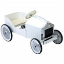 The Vilac Large Pedal Car in white by Vilac boasts a vintage design, with a chrome grille and four-spoke wheels featuring silent rubber tires. Its elegantly placed steering wheel and small seat evoke the charm of iconic classic cars, making it a potential family heirloom.