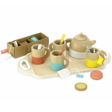 The Wooden Tea Set by Vilac is a delightful collection for children's tea parties, featuring a charming wooden pretend teapot, cups decorated with colorful bands, and an assortment of toy cookies. The set also includes whimsical tea bags, a box of packets, and delightful wooden biscuits all presented on a tray.