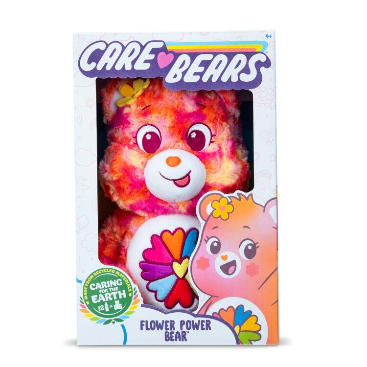 The Care Bears Eco-friendly Flower Power Bear by Basic Fun is a 35cm plush toy in orange and pink with flower designs. It comes in heart-and-flower themed packaging that proudly highlights its recycled materials.