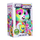 The Care Bears Eco-friendly Good Vibes Bear (35cm) by Basic Fun comes in a rainbow-patterned box with smiling illustrations, part of the "Caring Counts" collection that promotes joy and sustainability.