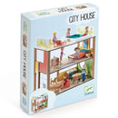 Djeco's Dolls' House - City House features a modern dolls' house with colorful furniture. The box illustrates the interior, showing figures in daily activities within the contemporary architecture.