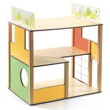 The Dolls' House - City House by Djeco features a modern, open design with multiple levels and colorful furniture. Its vibrant green, orange, and yellow leaf-patterned panels, along with an arched doorway and round window, offer a playful aesthetic inspired by modern movement architecture.