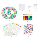 Introducing the DIY Flower & Butterfly Mobile by Djeco, a creative kit featuring a peace sign wreath adorned with colorful flowers. The set comes complete with a paint palette, brush, adhesive dots, suction hook, and butterfly stickers. Additionally, it includes eight sheets of floral outlines and gouache paints for endless artistic expression.