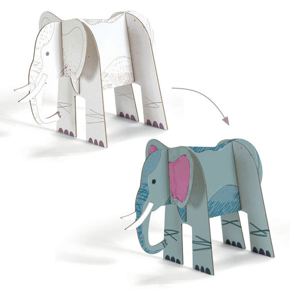 The "Colour, Assemble & Play - Savannah" kit by Djeco includes two paper elephant models—one in white and the other in grey-blue—crafted from interlocking pieces. An arrow illustrates the transition from the white model to the grey-blue version. This imaginative set features pink inner ears and tusks, combining coloring and assembly into an engaging savannah animals project.