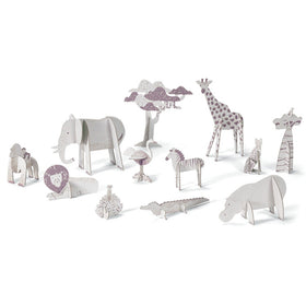 Discover Djeco's Colour, Assemble & Play - Savannah kit, showcasing a delightful set of cardboard savannah animals such as an elephant, giraffe, and lion. Adorned with purple and grey details and arranged in a row, these figures offer a fun experience in coloring and assembly while showcasing various poses and sizes.
