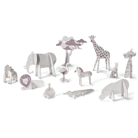 Discover Djeco's Colour, Assemble & Play - Savannah kit, showcasing a delightful set of cardboard savannah animals such as an elephant, giraffe, and lion. Adorned with purple and grey details and arranged in a row, these figures offer a fun experience in coloring and assembly while showcasing various poses and sizes.