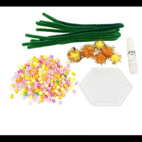 Surrounding a hexagonal pegboard on a white background are craft supplies like green pipe cleaners, multicolored beads, spiky seed pods, and clear glue from the Easter Flowers Mini Craft Kit by CREATIV COMPANY. Perfect for inspiring your creativity with an Easter-themed project.
