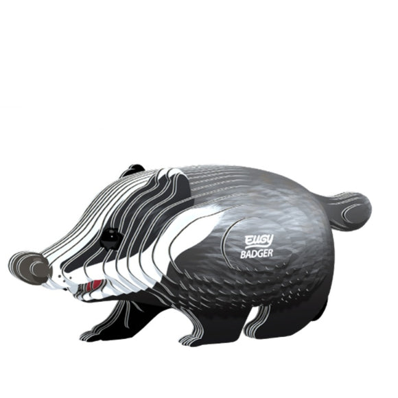 A stylized, cartoonish representation of a badger with "EUGY Badger" adorning its side. Crafted by EUGY with sustainable materials, the design features bold, curving lines in shades of black, gray, and white, giving it a modern and playful look reminiscent of their toy figures.