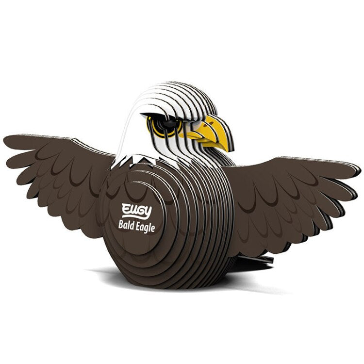 A 3D model called the EUGY Bald Eagle, crafted from eco-friendly black and white materials, features finely detailed wings and a prominent beak. The words "Bald Eagle" are elegantly printed on its side, capturing the creative charm of EUGY figures.