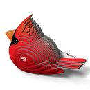 The EUGY Cardinal is a stylized sculpture crafted from interlocking, layered pieces, representing a Northern Cardinal. This geometric design features a bright red bird with black details around the eye and beak, and gracefully showcases the word "Cardinal" on its side.