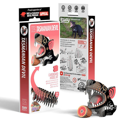 The EUGY Tasmanian Devil 3D cardboard model kit is showcased with eco-friendly packaging. The box contains an illustrated assembly guide and a photo of an actual Tasmanian devil, while the biodegradable kit features numbered cardboard pieces for straightforward assembly.
