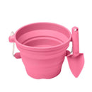 The SCRUNCH Flamingo Pink Mini Bucket & Spade is ideal for little gardeners, featuring a flexible, foldable silicone bucket with a rope handle for easy storage and transport, plus a handled shovel.
