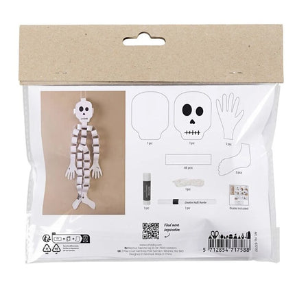 Introducing the Mini Craft Kit Paper Decorations, Skeleton from Creativ Company—a perfect Halloween craft kit for children. This delightful set features a paper skeleton with wavy arms and legs, includes guides for cutting out a skull and hands, and comes with a small glue stick. The packaging provides detailed assembly instructions and lists all components, featuring a barcode at the bottom for easy reference.