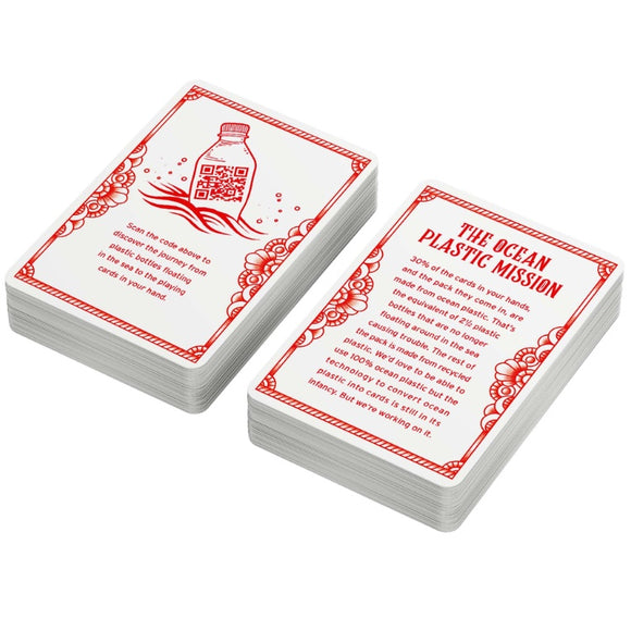 Two stacks of eco-friendly Ocean Plastic Playing Cards by Big Potato Games with red designs. The front card displays a plastic bottle along with a QR code and scanning instructions, while the back card showcases "The Ocean Plastic Mission," emphasizing ocean pollution and supporting recycled ocean plastic initiatives.