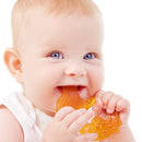 Baby gnawing on the rubber fish teether.