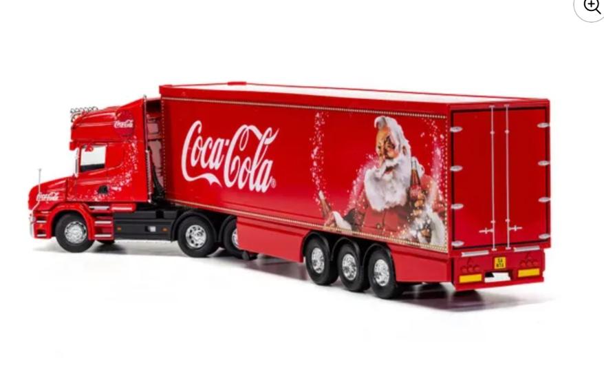 Rear view of the red Coca-Cola model Christmas truck.