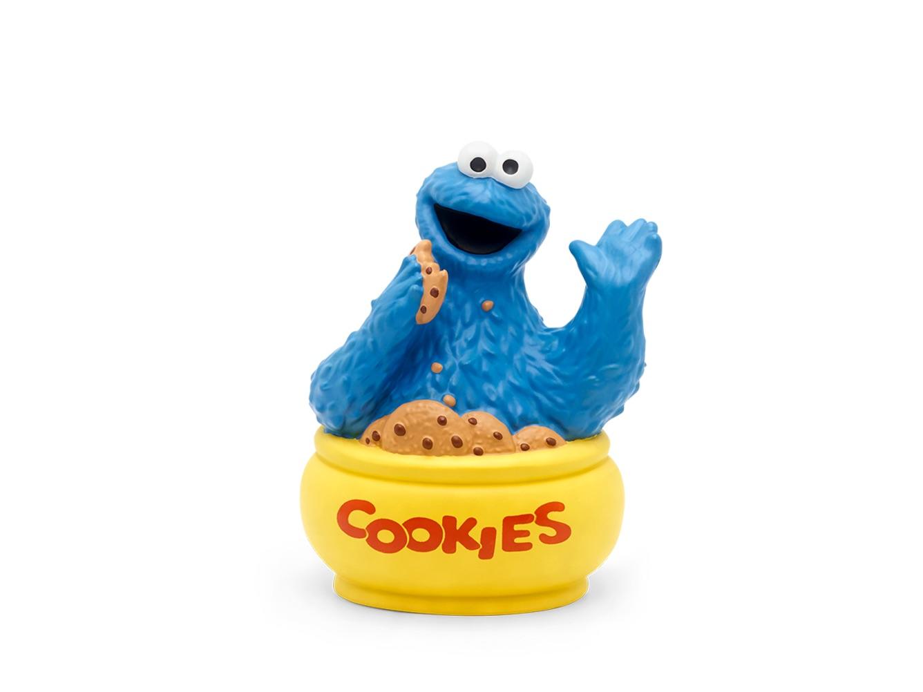 Blue Cookie Monster from Sesame Street sitting in a yellow tub.