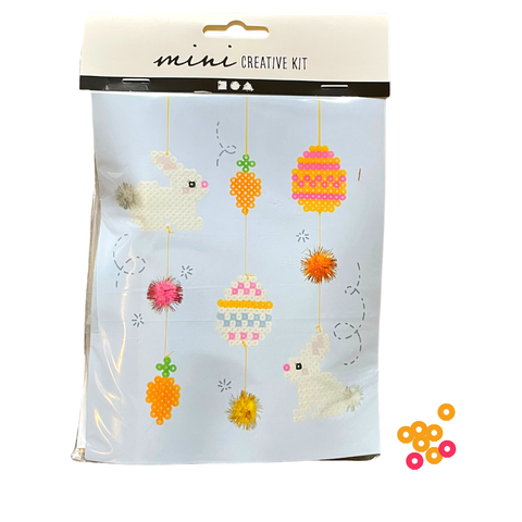 Packaging with Easter craft kit on white background.