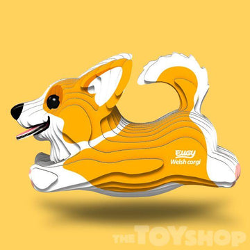 Yellow background. Cardboard corgi model.