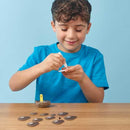 boy in blue tshirt sticking the owl model parts together.