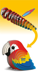 Pieces of the colourful parrot model in size order.