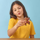 Girl in yellow t-shirt playing with the mini reindeer model