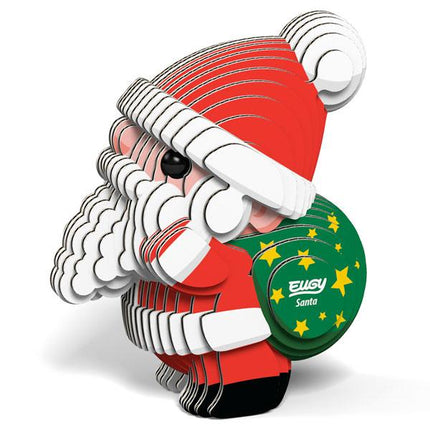 Cardboard Santa figure with green sack with yellow stars.