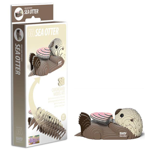 Sea otter card model beside box.