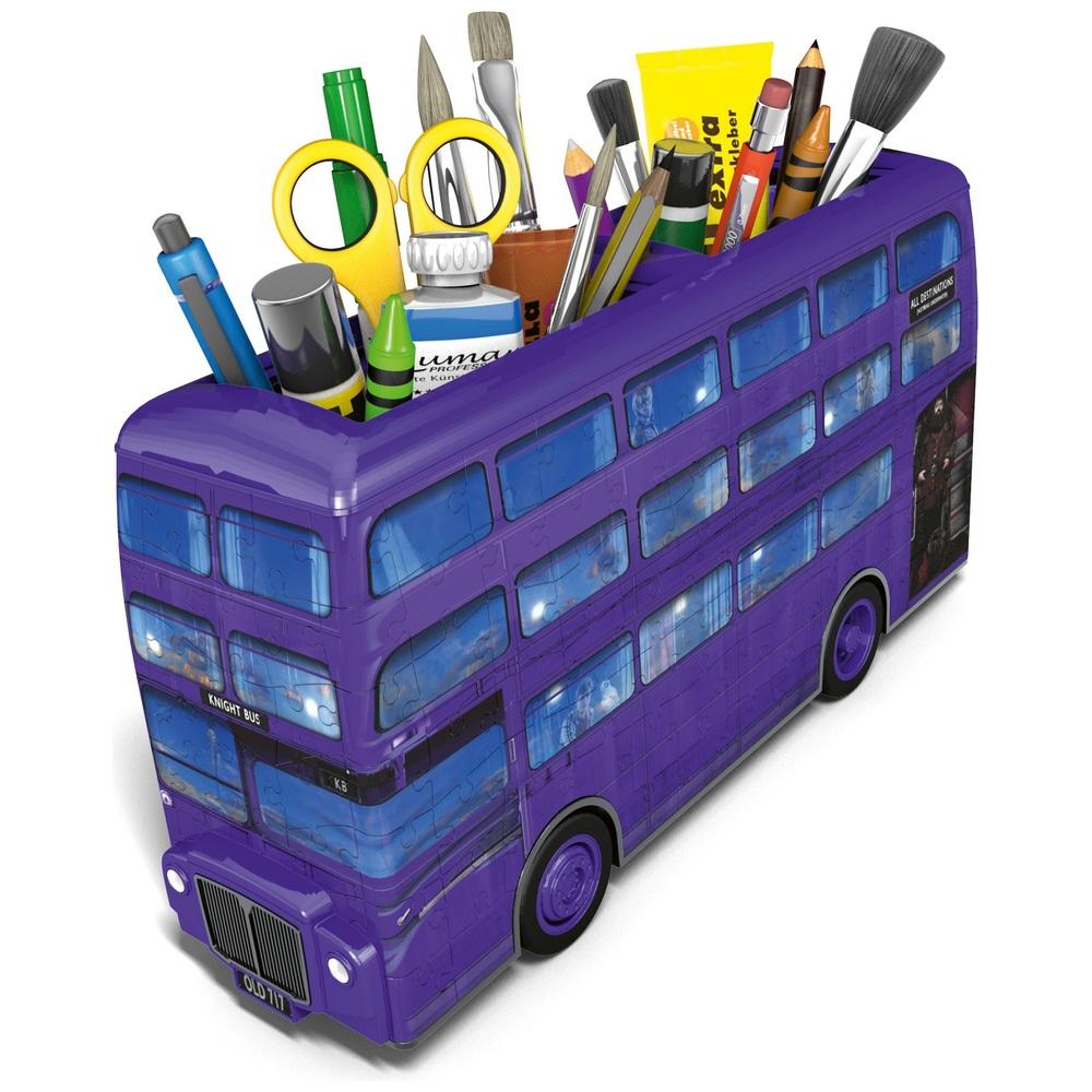Pens and pencils sitting in the Harry Potter purple Knight Bus.