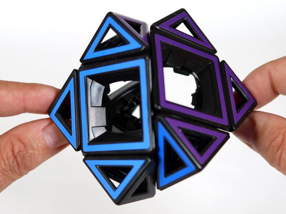 Pair of hands twisting the Hollow Skewb puzzle.