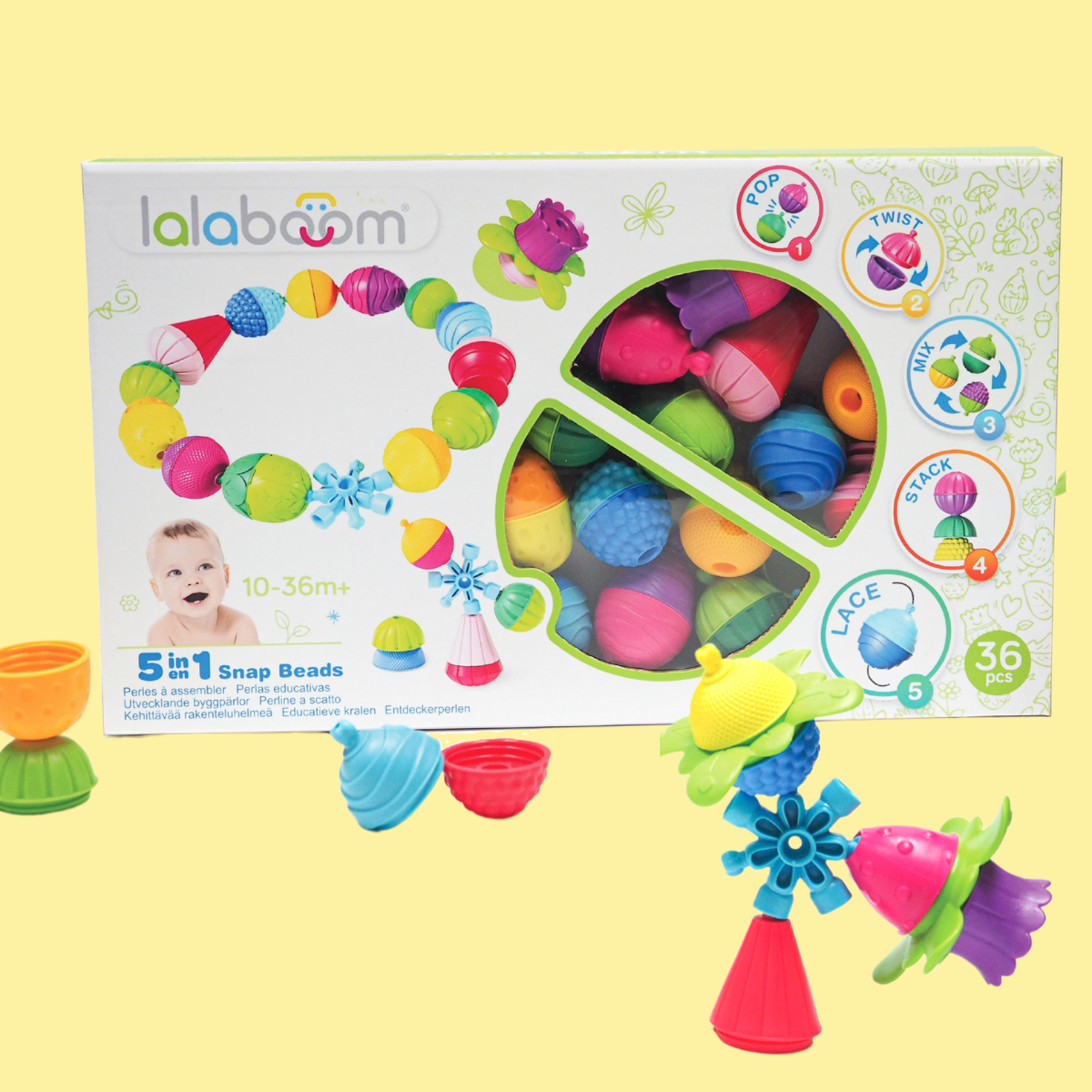 Lalaboom box of 36 pieces with yellow background with some brightly-coloured beads out of the box.
