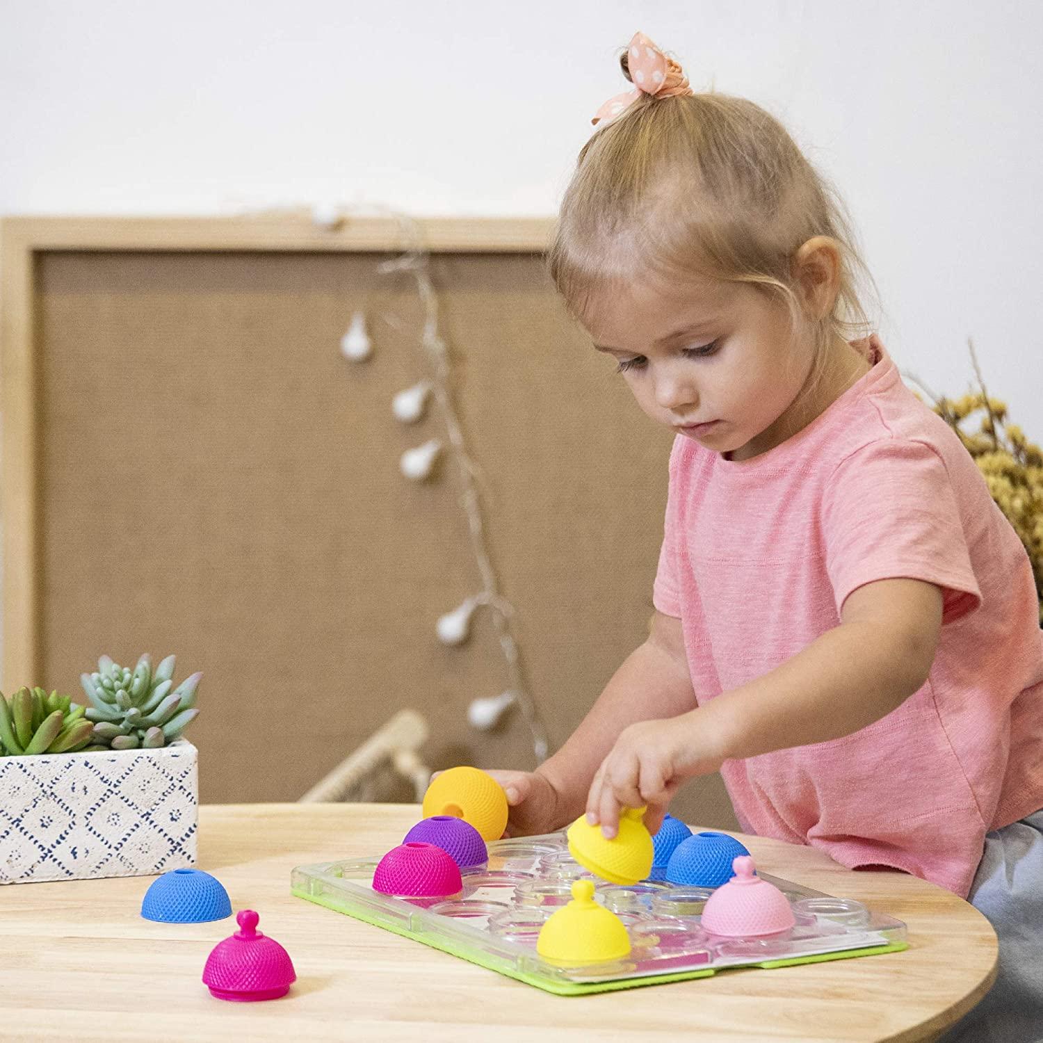 Young  girl playing with the Lalaboom peg-board.