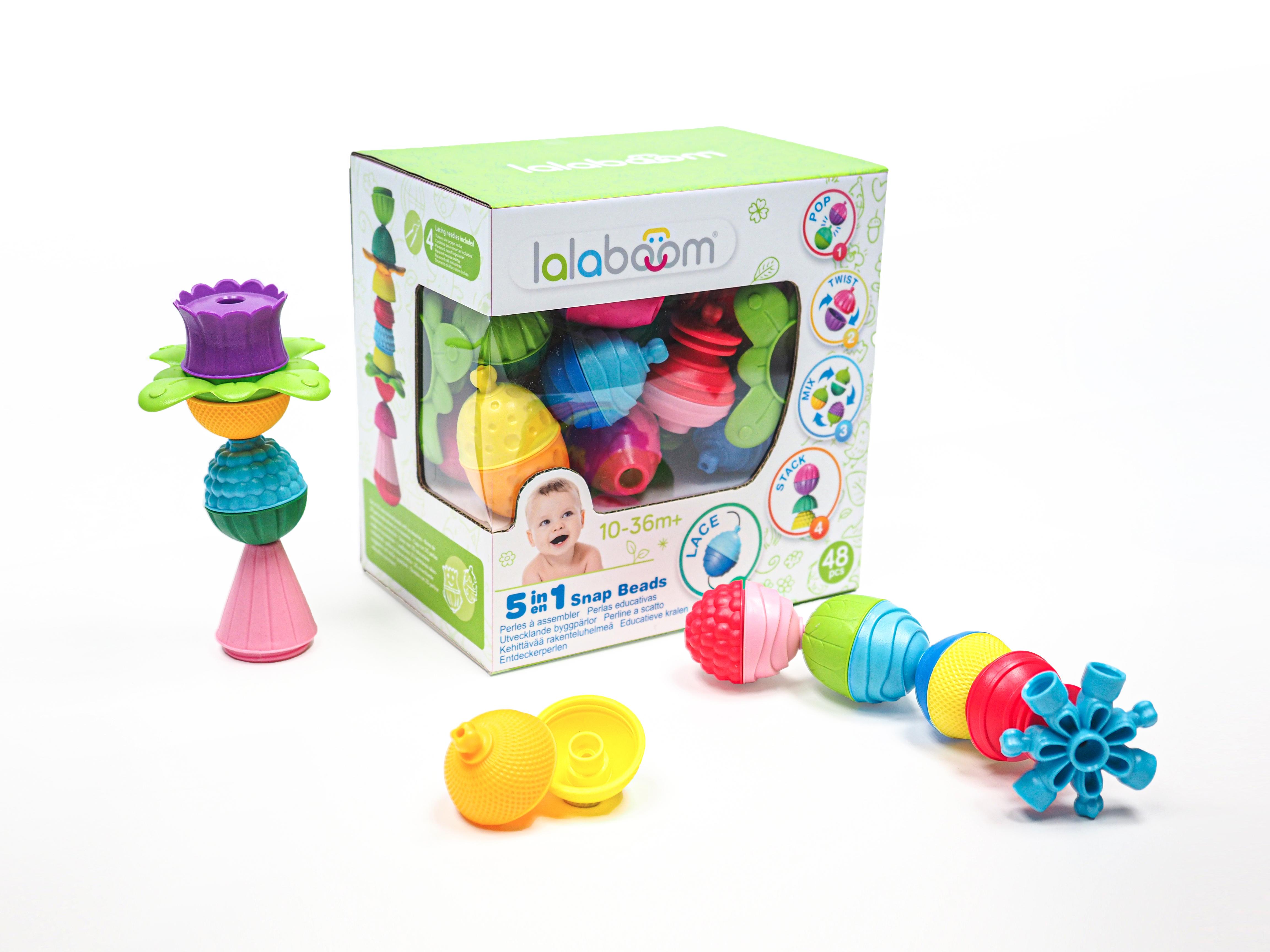 Box with colourful toy pieces that snap and twist together.