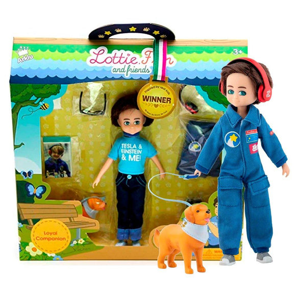 Hayden Lottie Doll standing with toy dog beside manufacturer's packaging.